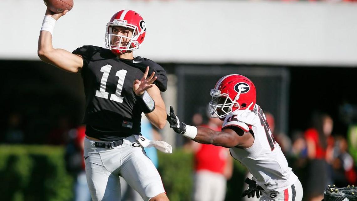 Outside linebacker D'Andre Walker (15) pressures quarterback Greyson Lambert (11) in Saturday's G-Day spring game. 