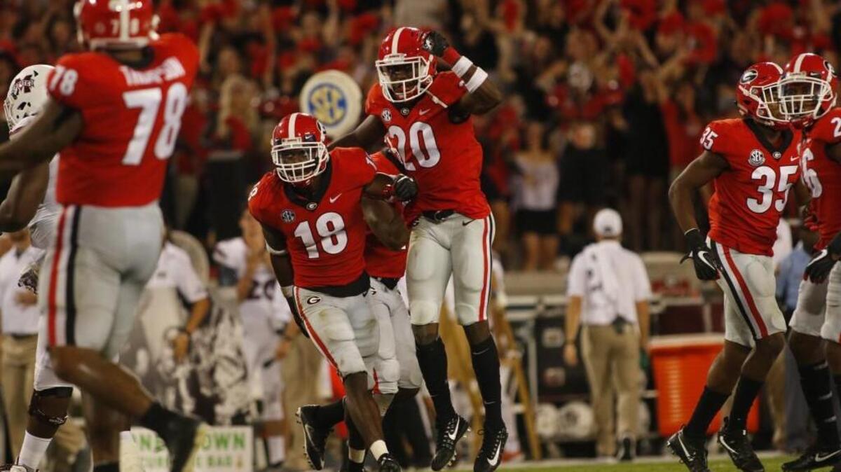 Georgia’s defense celebrates after a play against Mississippi State.