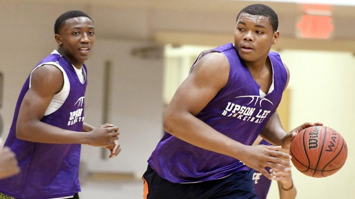 Upson-Lee’s Travon Walker, right, was a member of the Knights’ 2016-17 GHSA Class 4A basketball championship team. He is getting some strong football recruiting looks, with Georgia among the teams at the top of the list.