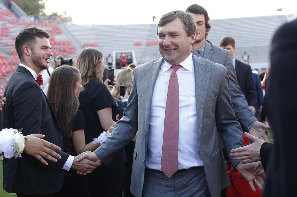 Georgia coach Kirby Smart enters Sanford Stadium during the Dawg Walk before the team's NCAA college football game against Missouri on Saturday, Oct. 14, 2017, in Athens, Ga.