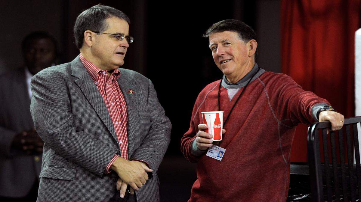 UGA president Jere Morehead (left) seen speaking with athletics director Greg McGarity. 