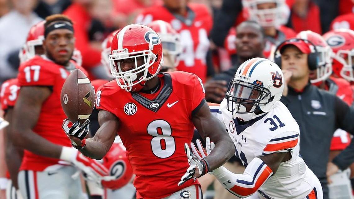 Georgia wide receiver Riley Ridley (8) brings in a one-handed catch in Saturday’s game against Auburn.