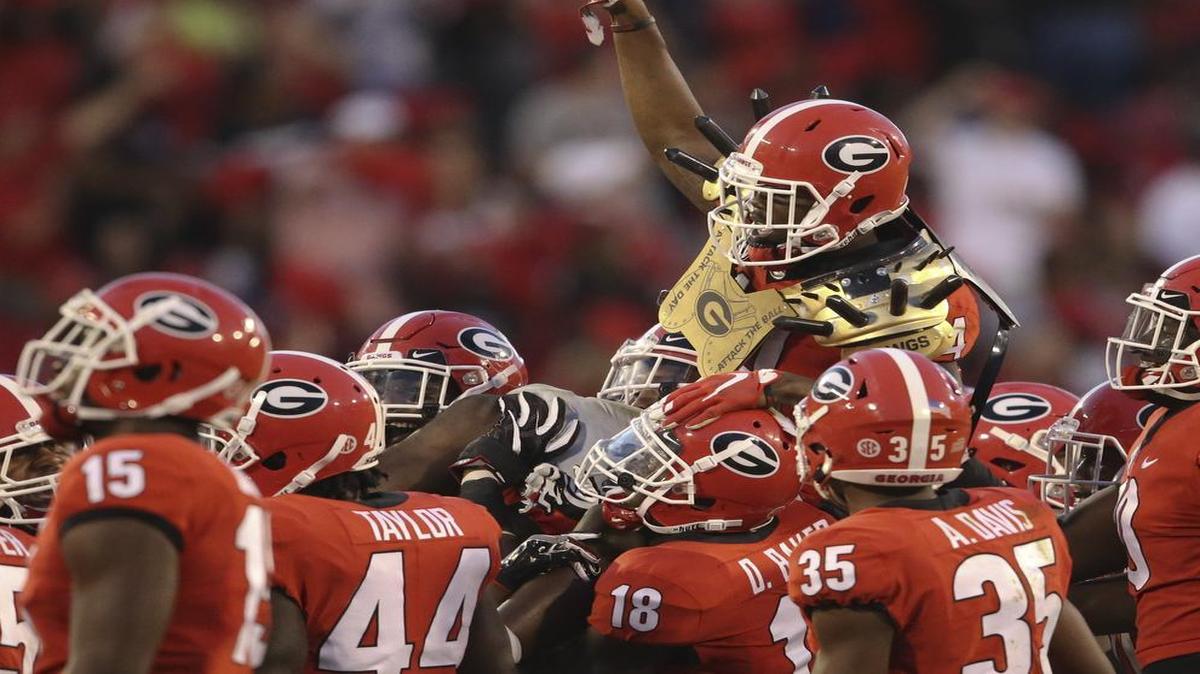 Georgia defensive back Malkom Parrish (14) came up with the game-clinching interception against South Carolina.
