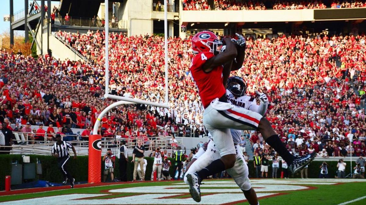 Georgia receiver Mecole Hardman catches a touchdown over South Carolina defensive back Jamyest Williams.
