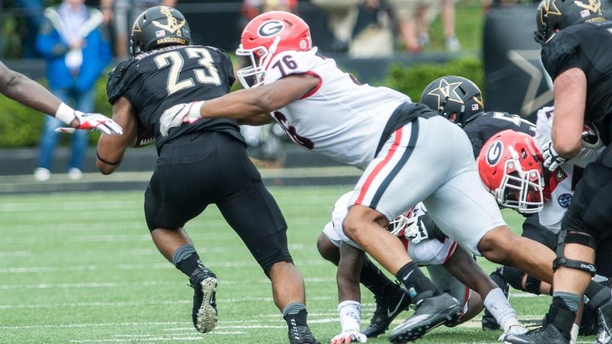 Georgia defensive lineman Michail Carter records a tackle against Vanderbilt.