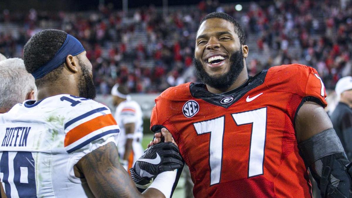 Georgia offensive guard Isaiah Wynn (77) and Auburn defensive back Nick Ruffin (19) after last year’s game.