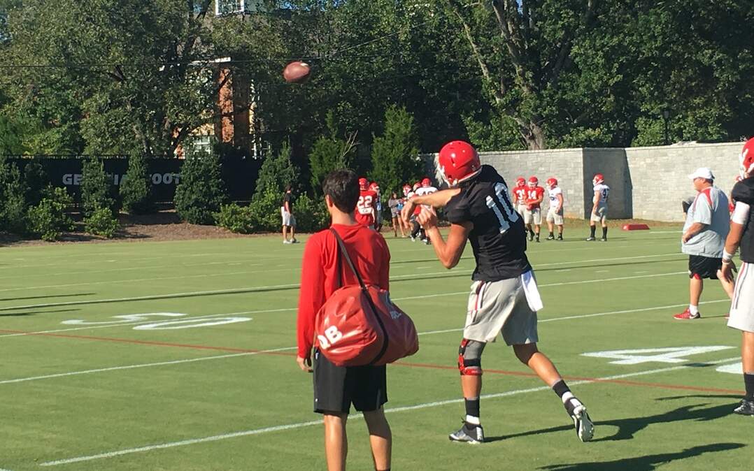 Jacob Eason throws a pass during Monday's practice. 