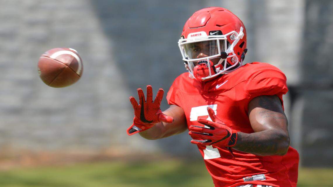 D'Andre Swift catches a pass during practice. 