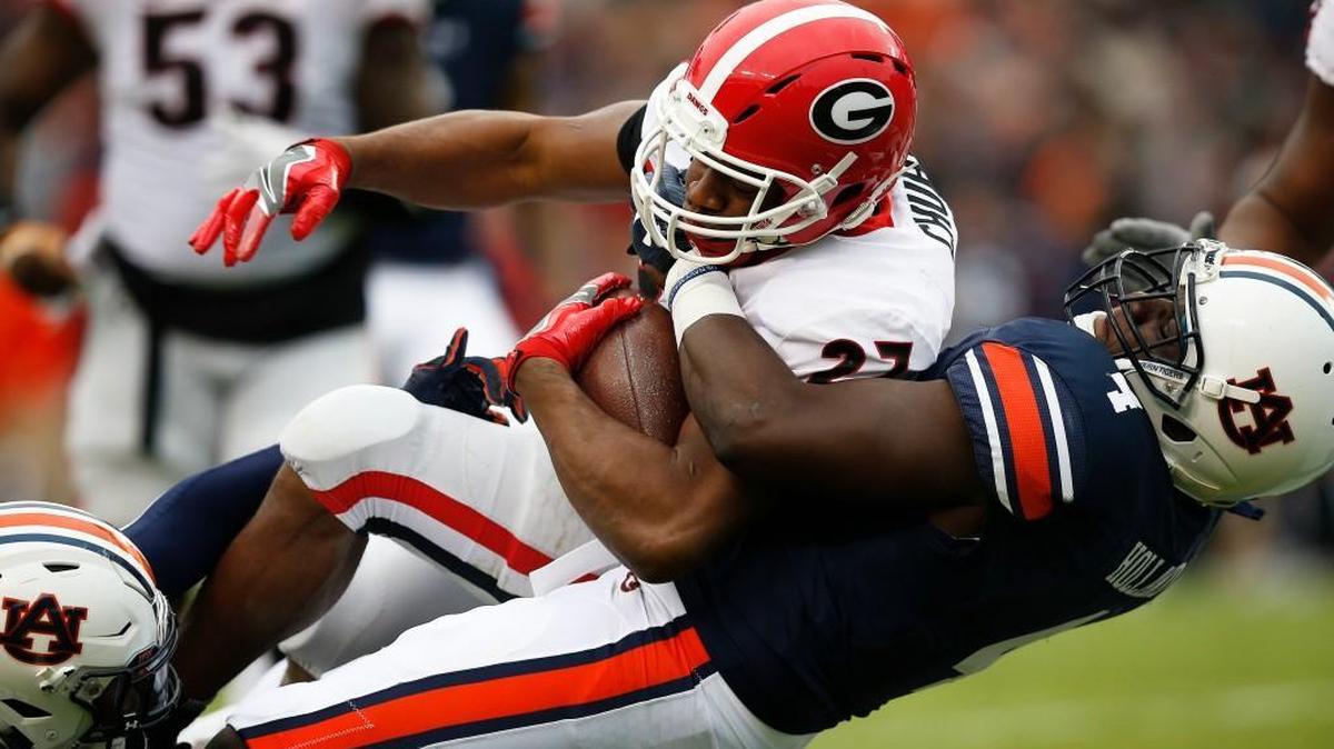 Georgia running back Nick Chubb is tackled by Auburn linebacker Jeff Holland.