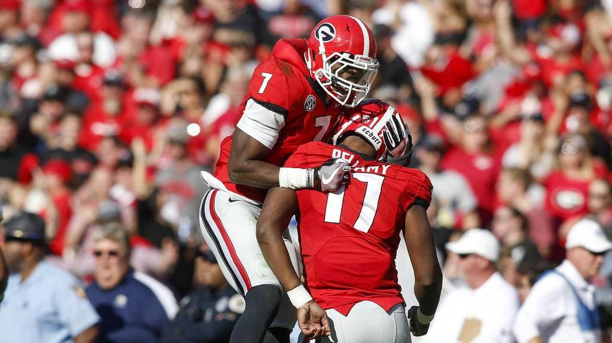 Seniors Lorenzo Carter (7) and Davin Bellamy (17) will play one final home game at Sanford Stadium on Saturday against Kentucky.