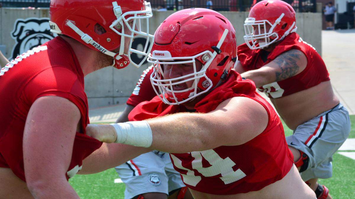 Georgia center Brandon Kublanow (right) is using a new technique for snapping out of the shotgun. 