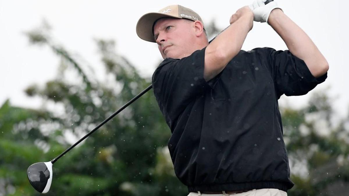 Scott Dorton watches his drive on the first hole of the Brickyard at Riverside in the Dixie Classic.
