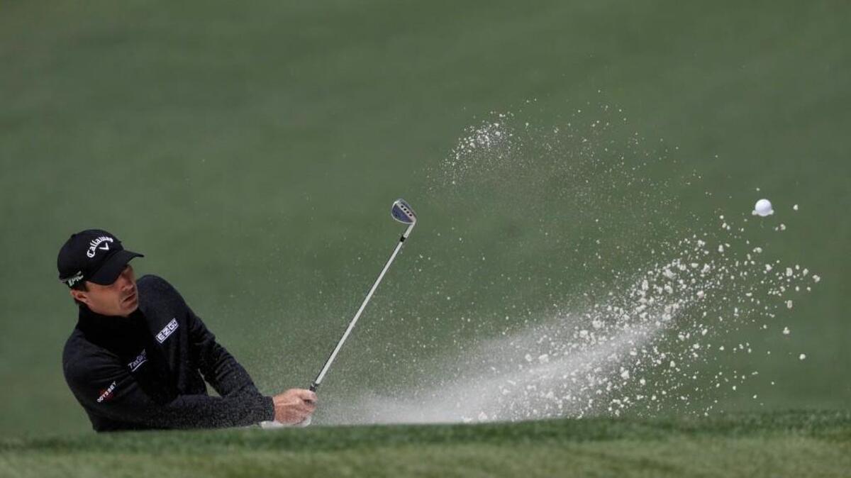Kevin Kisner hits from a bunker on the second hole at the Masters Friday.