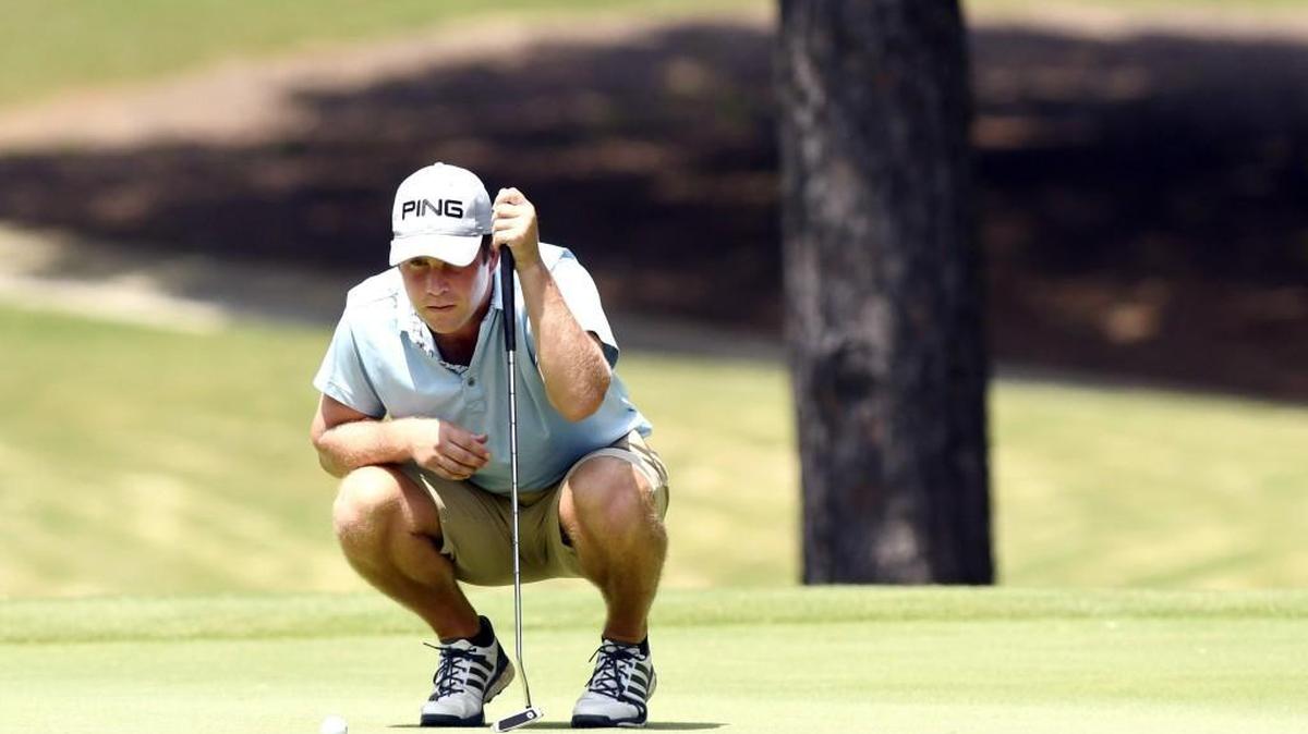 Jon David Kennedy lines up his birdie putt on the par-4 eigth hole at the Brickyard at Riverside during the second round of the Dixie Classic on Saturday.