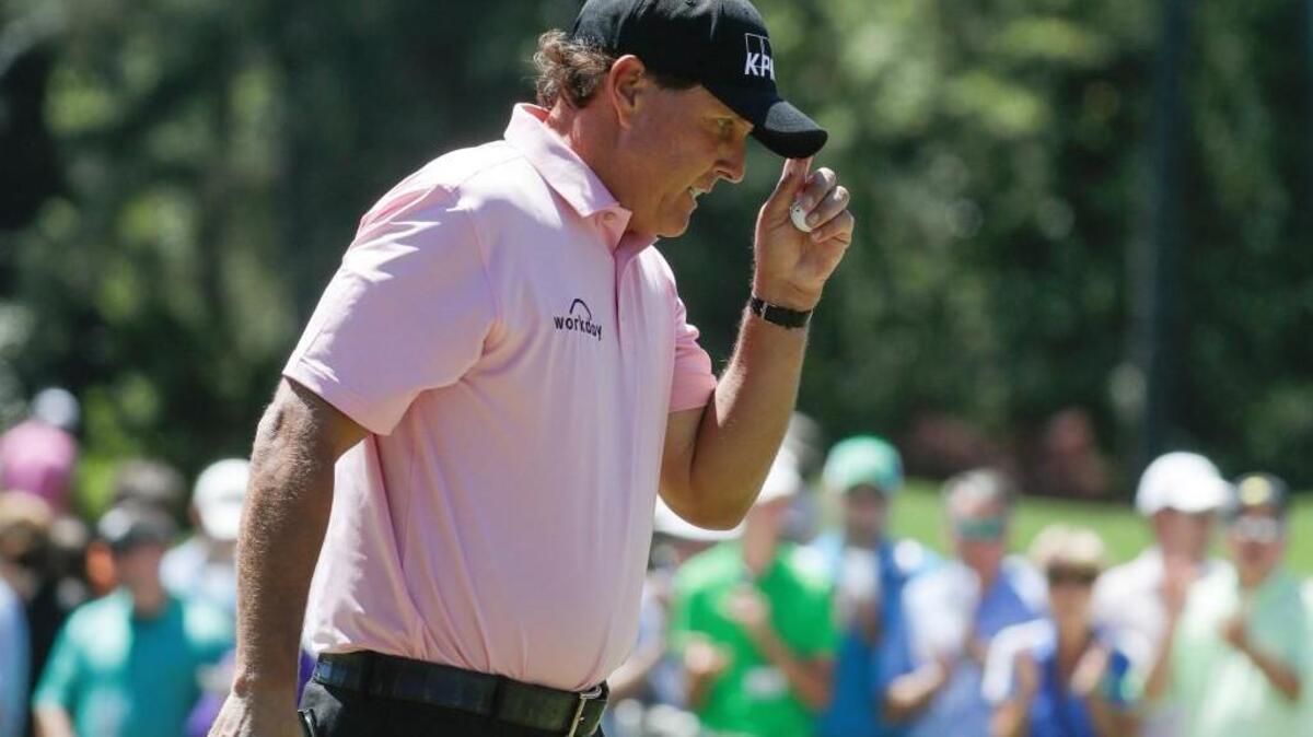 Phil Mickelson reacts after saving par on the first hole during the final round of the Masters.