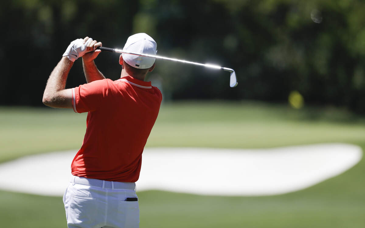Russell Henley hits a shot Sunday on No. 4 at the Masters. 