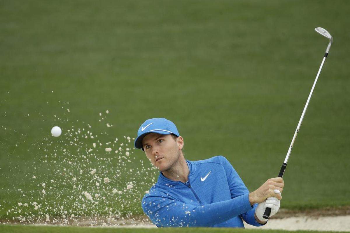 Russell Henley hits from a bunker on the second hole during the third round at the Masters golf tournament April 8, 2018.
