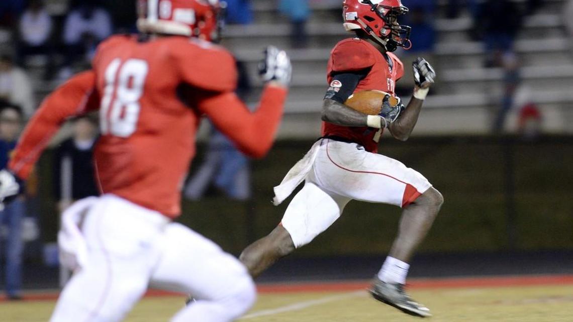 FPD receiver Titus Moore (1) heads for the end zone with a Dalton Cox pass in the third quarter of Friday’s first-round playoff game.