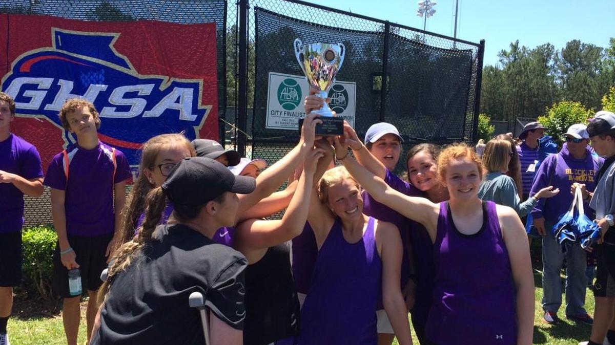 Bleckley County’s girls hold up the GHSA Class 2A girls tennis state championship trophy after beating Screven County 3-0 on Saturday.