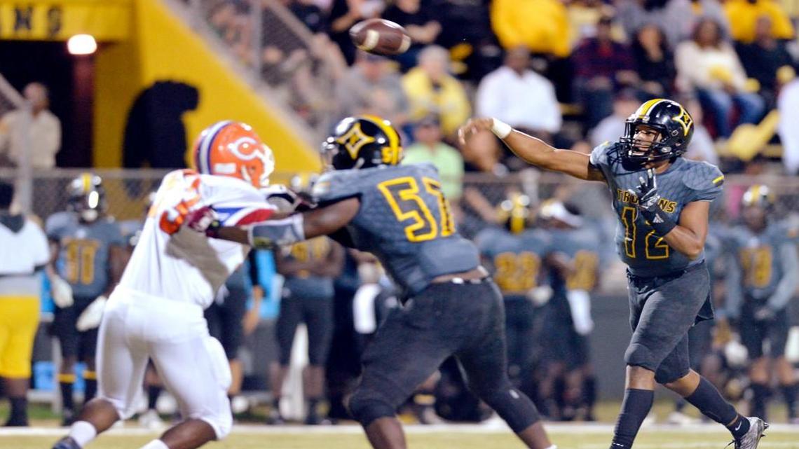 Peach County quarterback Antonio Gilbert (12) and the Trojans have won seven straight games.