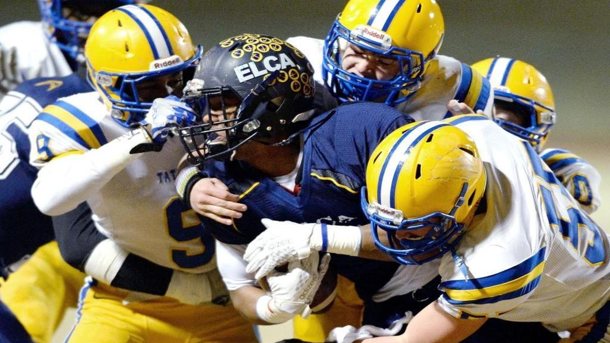 Tattnall defenders converged on Eagle's Landing Christian running back Trevor Gear (4) at the line of scrimmage during their GHSA Class 1A private school semifinal game Friday night in McDonough.