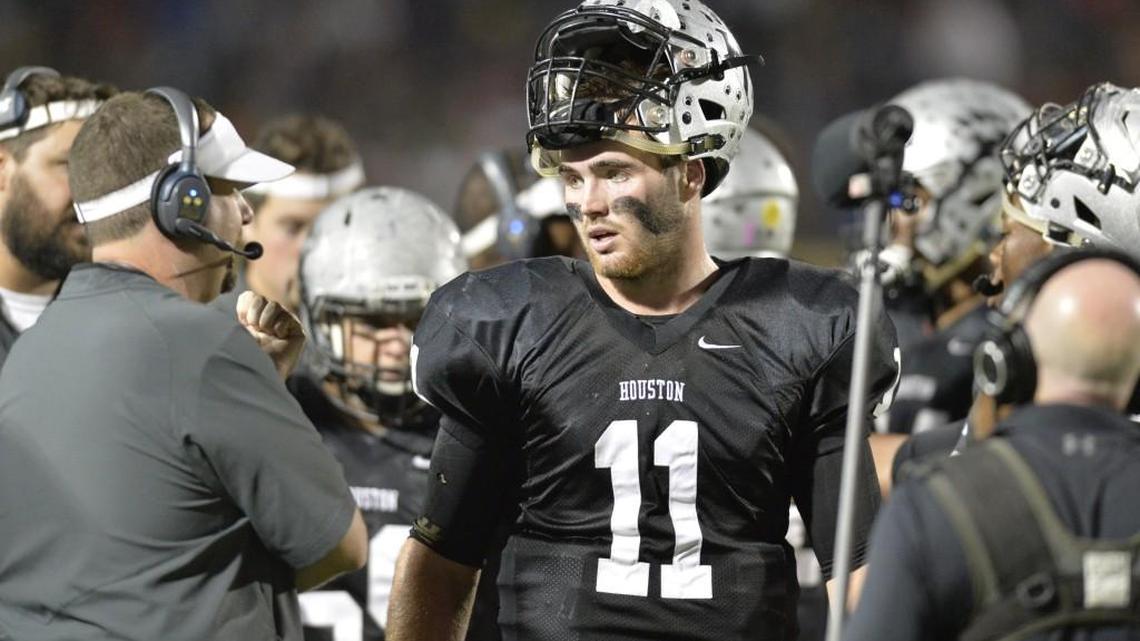 Houston County quarterback Jake Fromm (11) talks with head coach Von Lassiter (left) during a timeout in their game against Northside on Oct. 28, 2016.