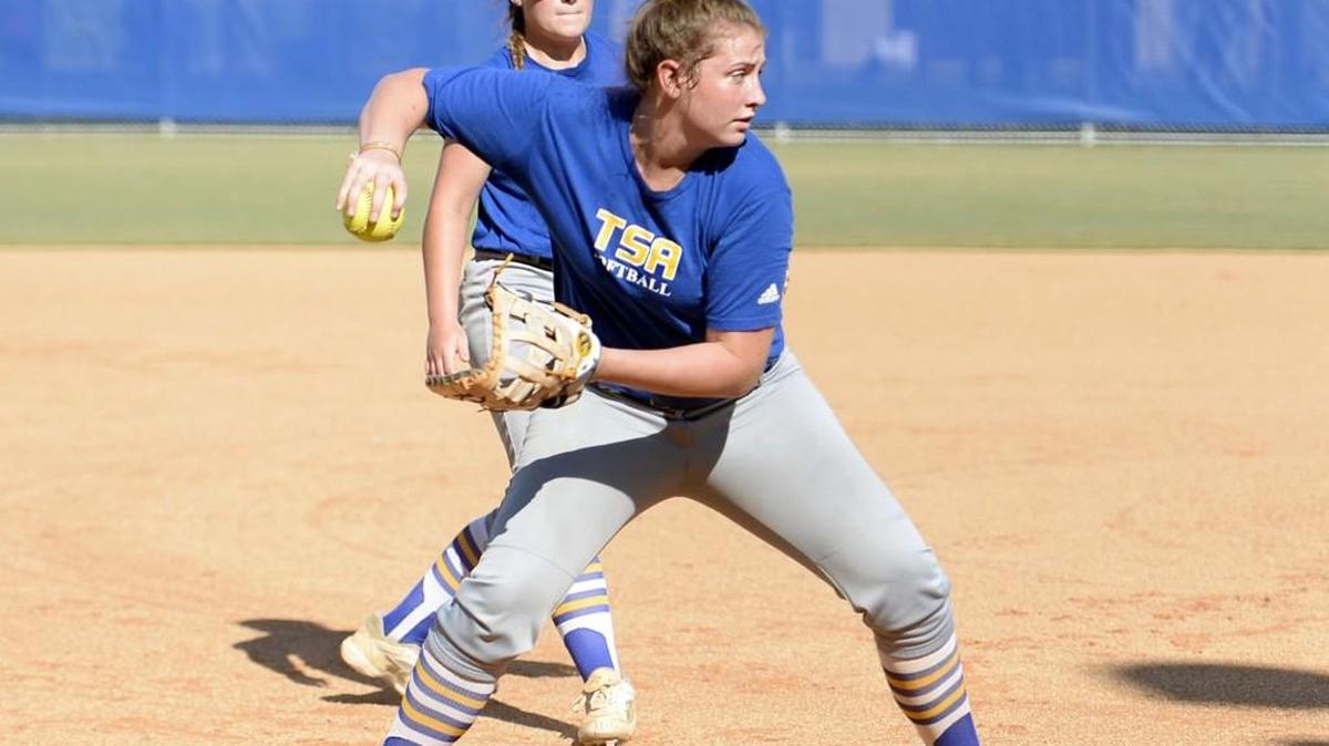 Tattnall Square first baseman Allie Gordon handles a bunt during infield practice Monday.