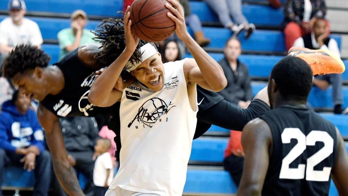Southwest's Aaron Ridley (3) is fouled by Warner Robins' Nelson Philips (10) during the MacTown versus WarTown Basketball Shootout Sunday at Tattnall.
