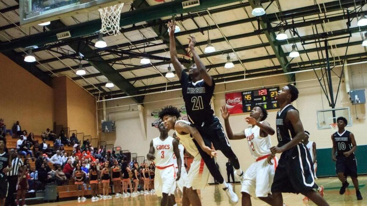 Westside's Khavon Moore (21) shoots a short jumper against Rutland in their GHSA Class 3A Region 4 matchup.
