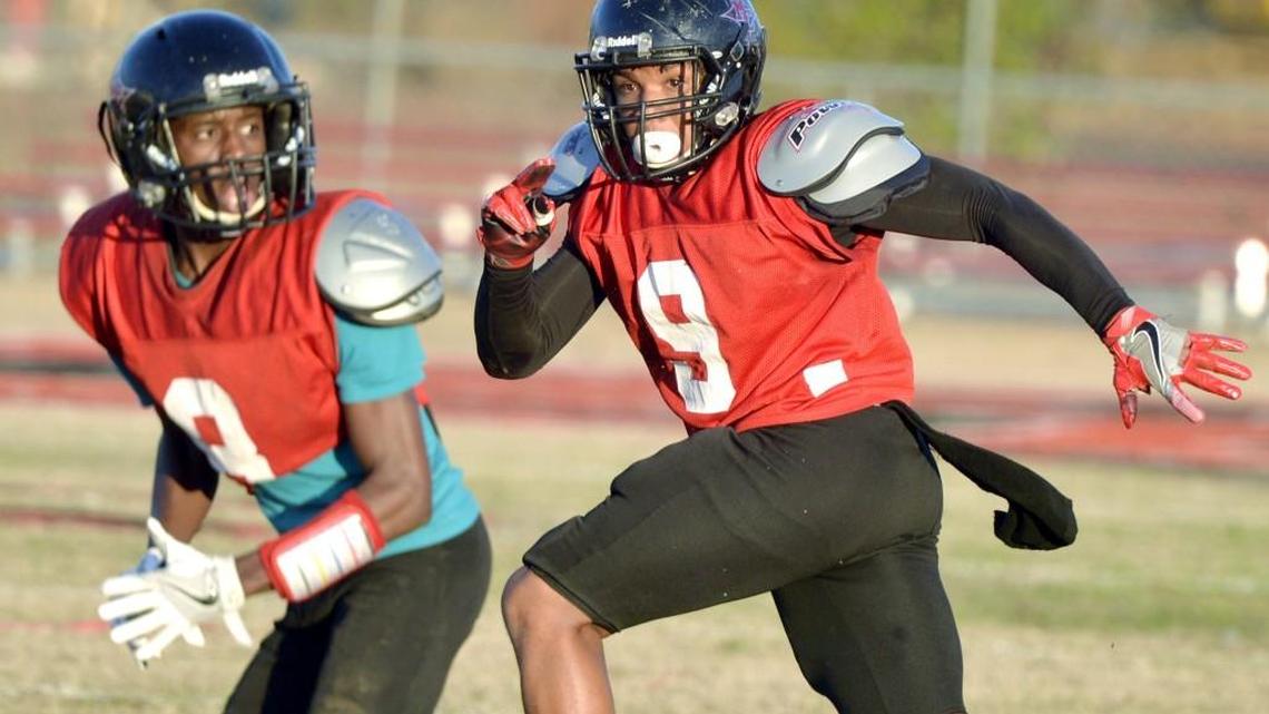Macon County cornerback Tyrese Adkinson (9) follows a receiver during practice Tuesday afternoon.