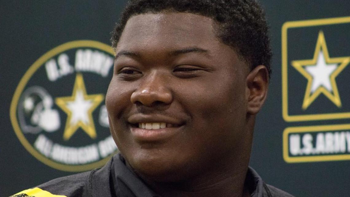 Houston County’s Trey Hill smiles for a photos in his new U.S. Army All-America jersey Monday.