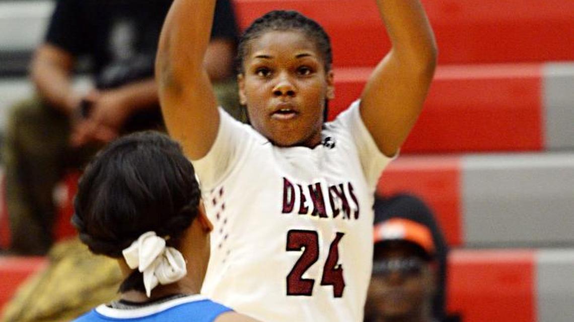 Warner Robins' Shontrice Austin (24) shoots a 3-pointer against Columbia.