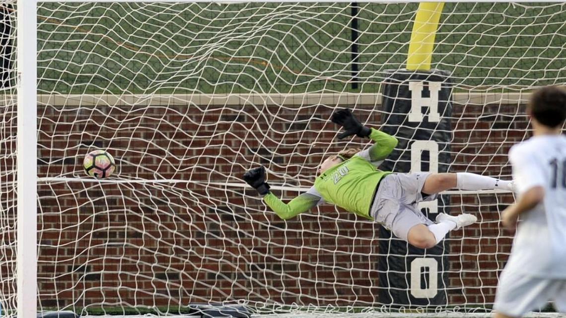 Houston County goalkeeper Declan Furlough goes high but can’t stop Centennial's first goal. By the end of the half, the Bears trailed 3-1.