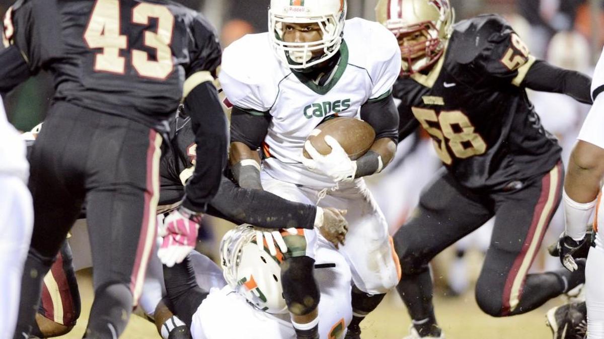 Rutland running back Montez Cheney (2) looks for a hole in Westside’s stout defense during their game earlier this season.