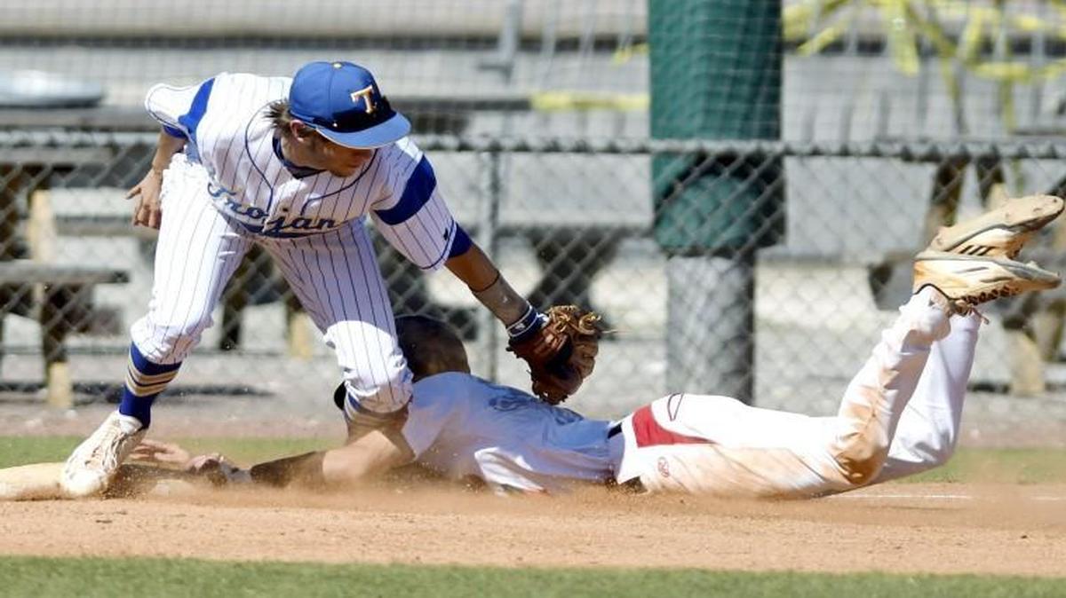 Tattnall Square third baseman Luke Laskey (1) loses control of the ball as Savannah Christian's Justin Anderson slides safely into third during Friday’s GHSA Class 1A private school baseball championship against Savannah Christian.