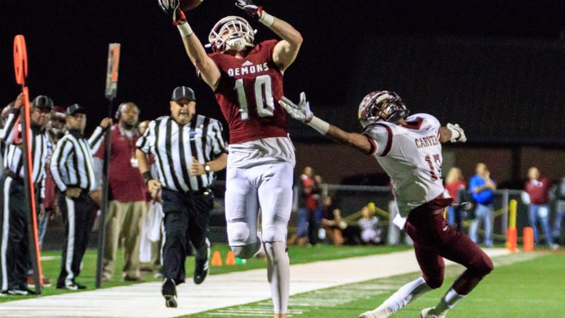 Warner Robins' Tyler Fromm (10) catches a pass on the sideline in the Demon’s semifinal game against Carver-Atlanta.