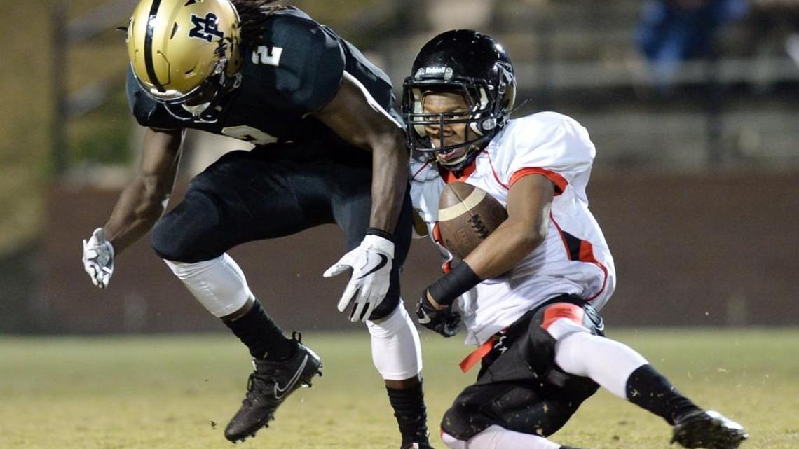 Mary Persons punt returner Tre Slaton (2) coughed up a fair catch after getting interfered with by Baldwin’s defender Friday night. The Bulldogs got the ball back with a penalty.