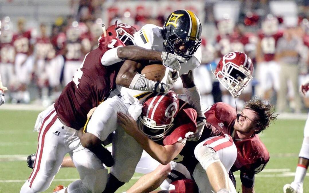 Peach County's Kearis Jackson, center, and the Trojans won 12 games last year.