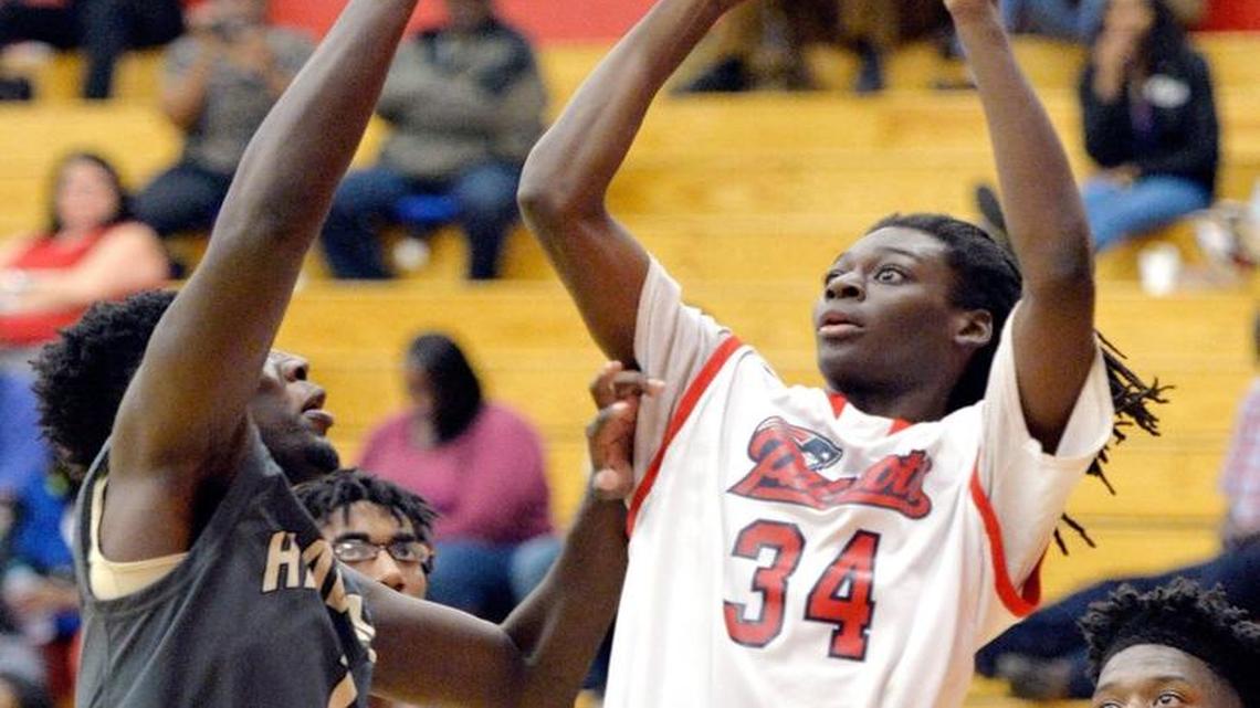 Southwest guard Kenterrious Goolsby (34) puts up a shot in the lane during their game against Washington County Tuesday night.