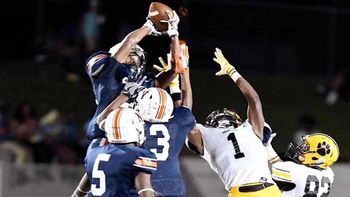 Northside defensive back Alijah McGhee (28) intercepts a pass intended for Valdosta's Ezekiel Menefee (1) during their game Friday night.