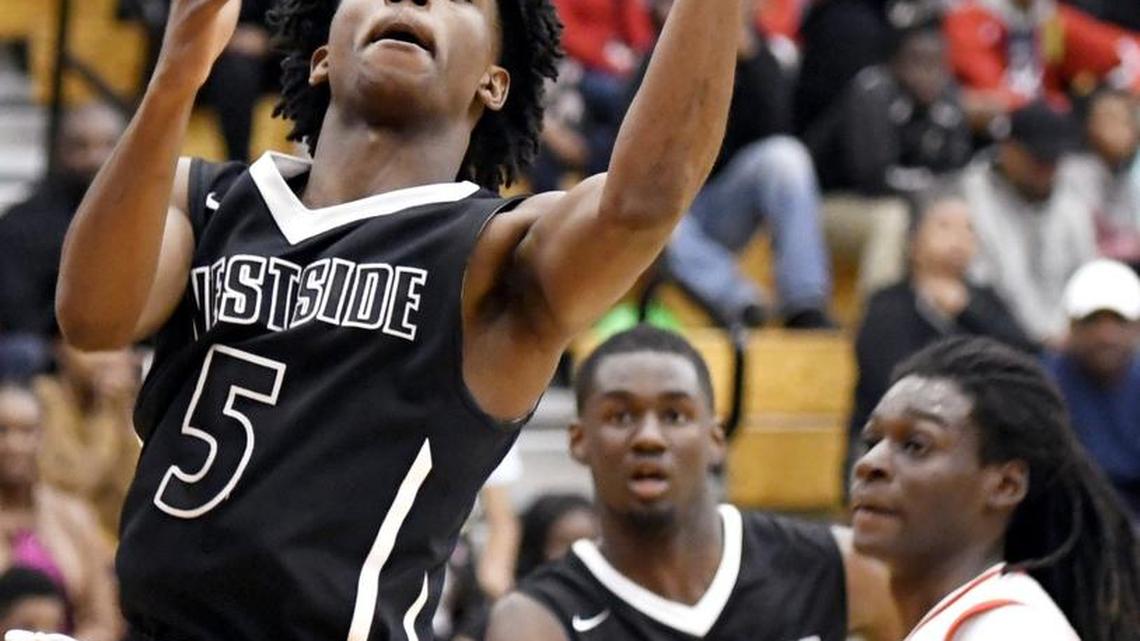 Westside guard Trey Foster (5) puts up a shot in the lane during their game at Southwest Friday night.