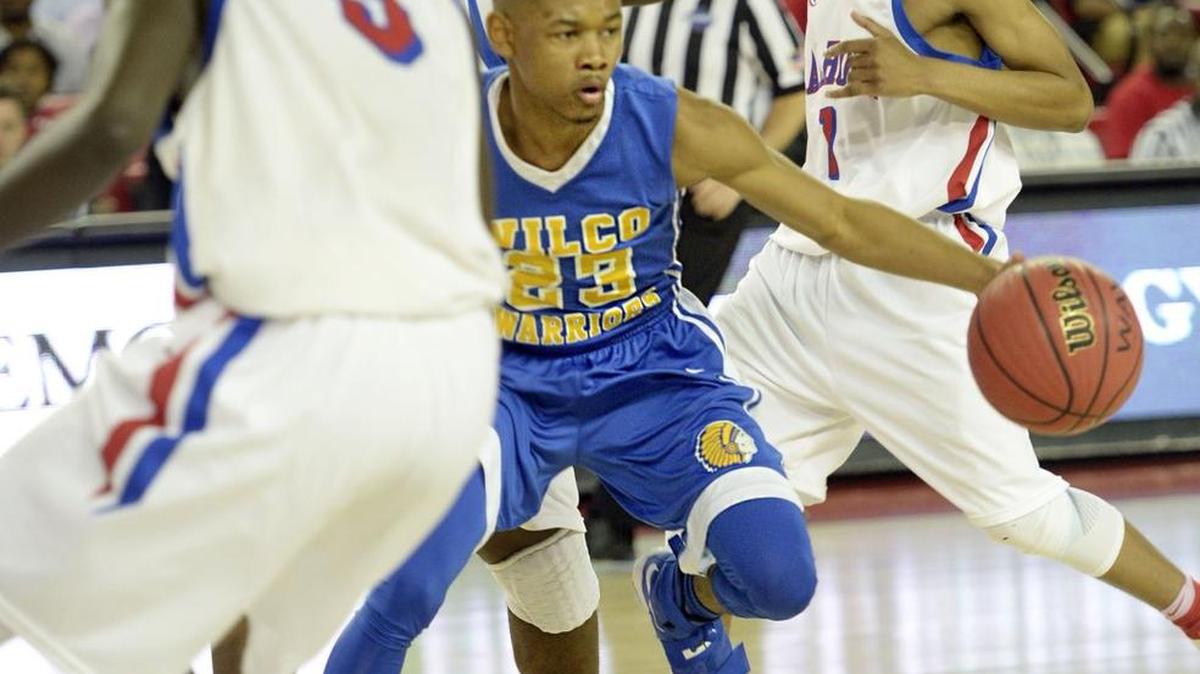 Wilkinson County guard Jadaveon Jones (23) ran into heavy Calhoun traffic before loosing the ball. The Warriors beat Calhoun to win the GHSA Class 1A public school championship Wednesday.