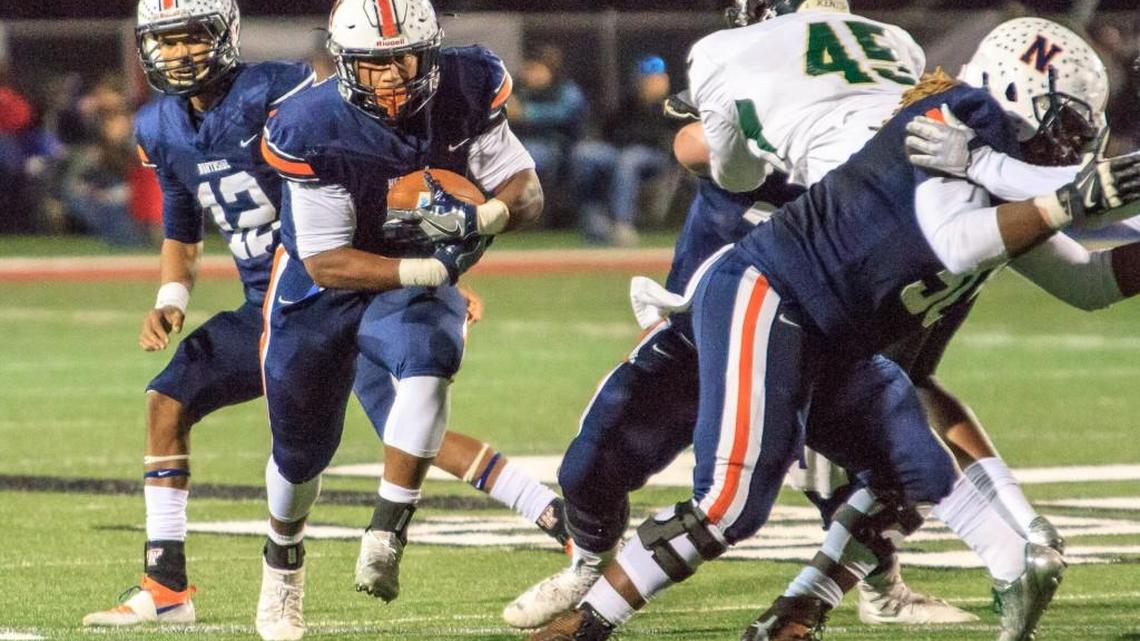 Northside’s Desean Dinkins (5) runs through a big hole in Hughes’ defensive line in their GHSA Class 6A playoff game.
