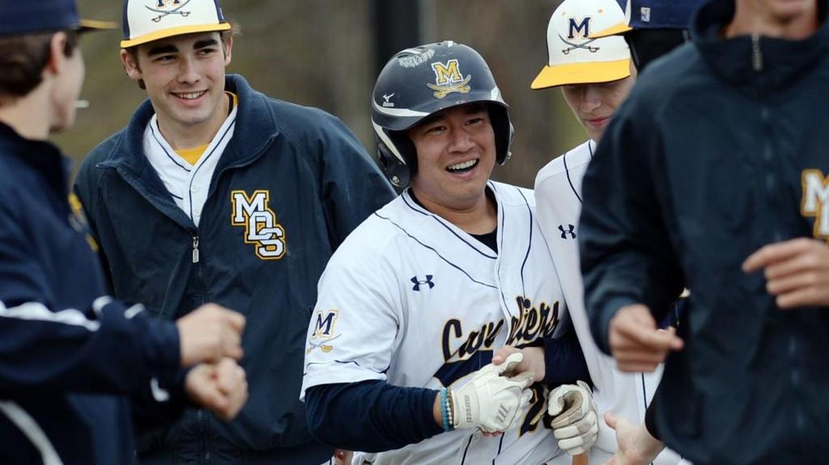 Zach Tong gets congratulations after hitting a two-run homer for Mount de Sales against FPD on Tuesday.