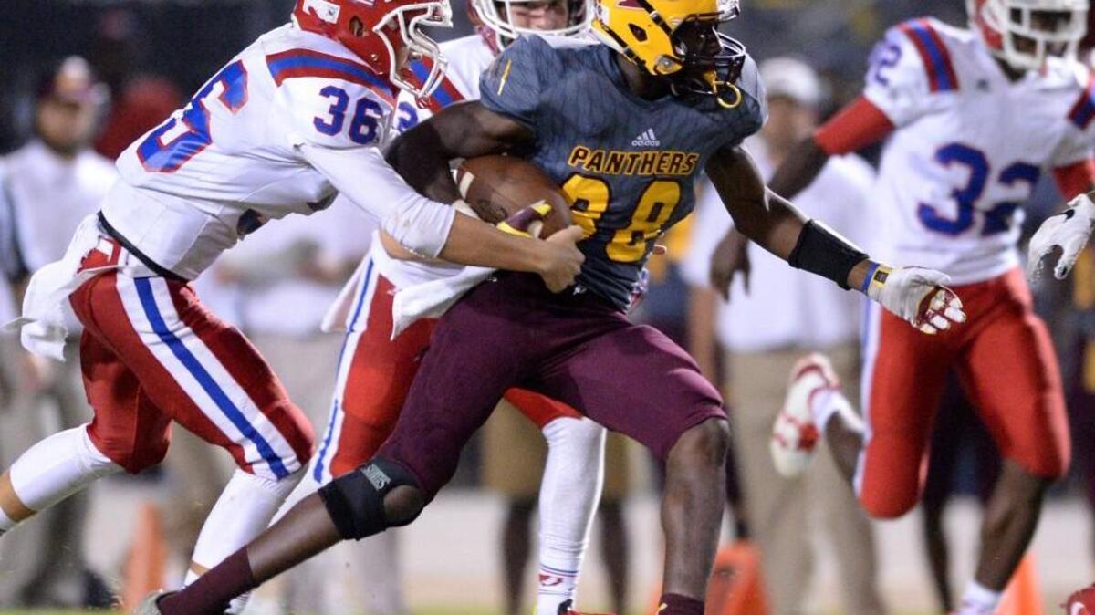 Perry Panther Malik Mullins picks a big first down on second half action Friday night against Veterans High School.