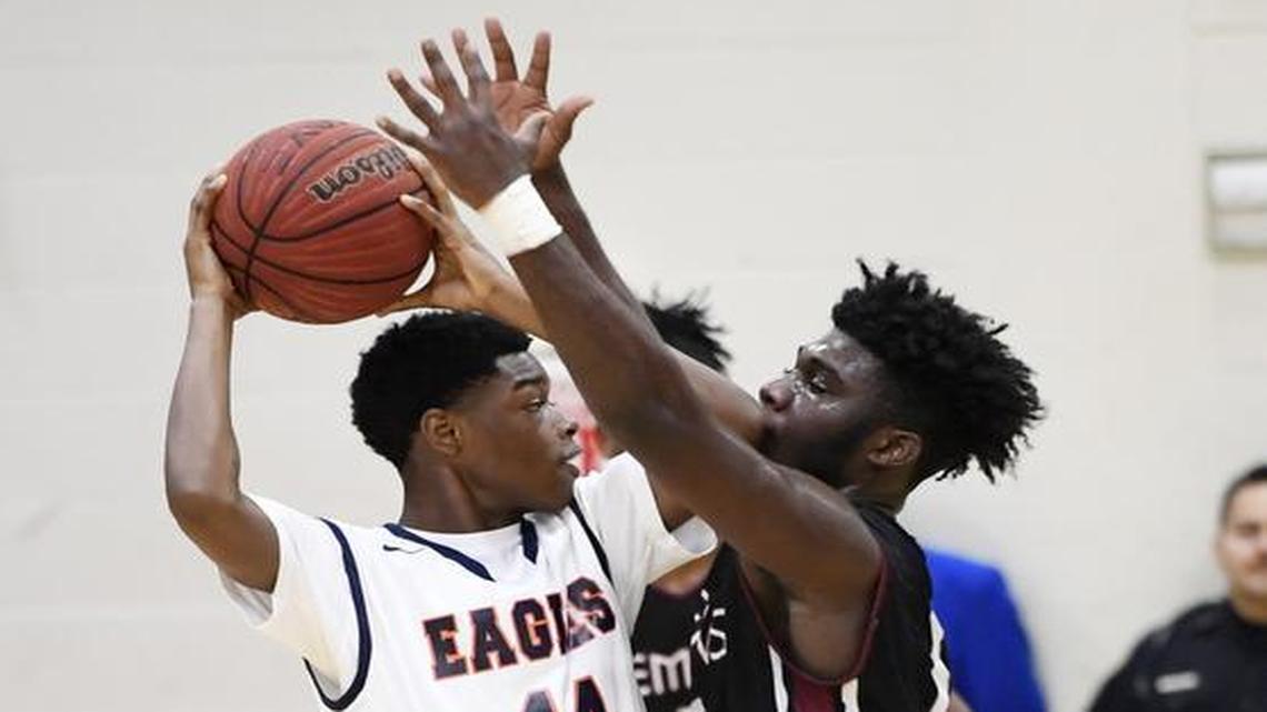 Northside’s Tyler Level (14) gets some close defense from Warner Robins’ Jaron Zanders (12) during their Jan. 21 meeting at Northside.