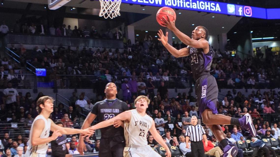 Upson-Lee's Tavias Fagan (24) glides into the lane to score in their GHSA Class 4A final against St. Pius X.