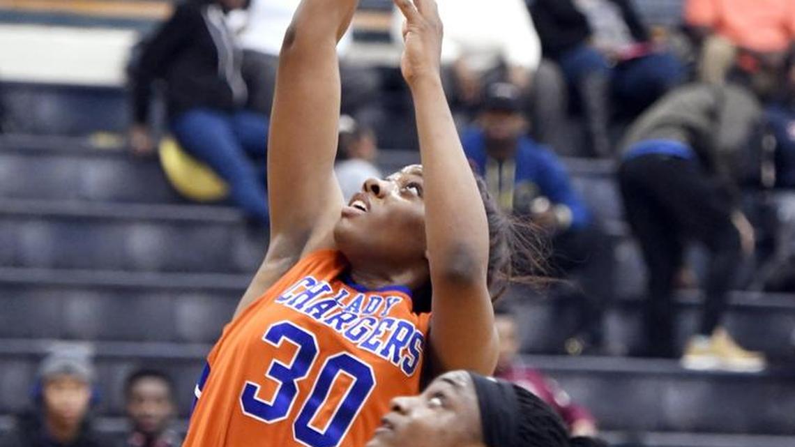 Central forward Jada Clowers (30) puts up a shot during the Chargers' game against Washington County Friday night.