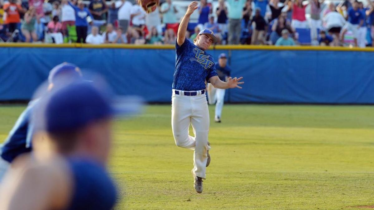 Tattnall Square shortstop Cory Bartholomew (18) slings his glove as his team celebrates a state championship win over Hebron Christian on Monday.