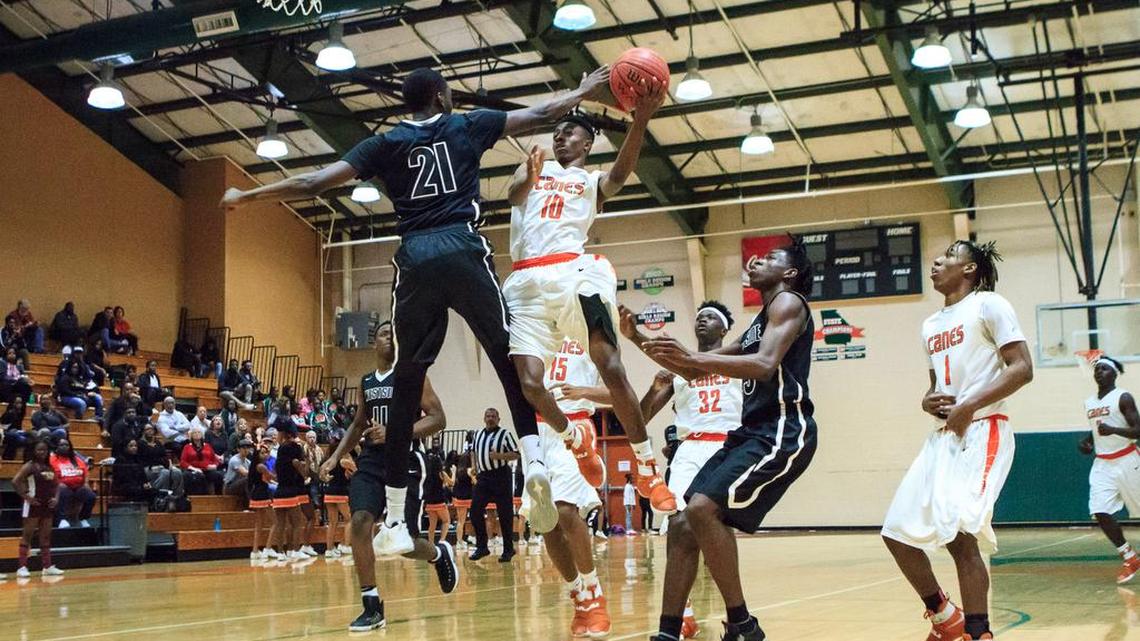 Rutland's Timshad Hughes (10) shoots over Westside's Khavon Moore (21) in their GHSA Class 3-4A matchup.